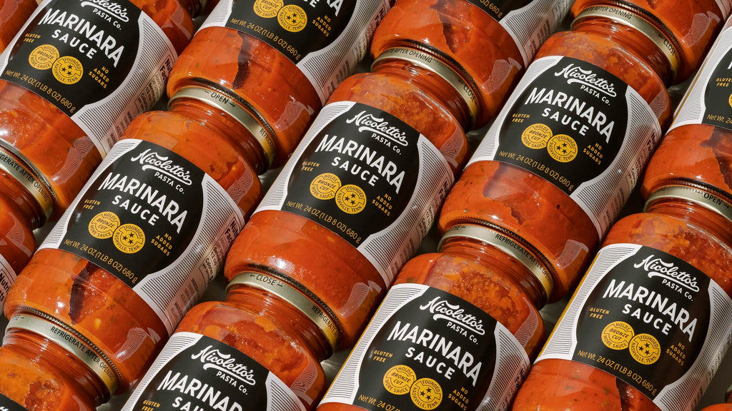 angled rows of jars of Nicolettos Marinara sauce